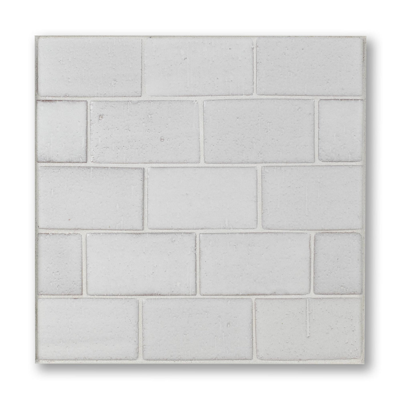 Rectangular concrete paver with a grid pattern on a white background